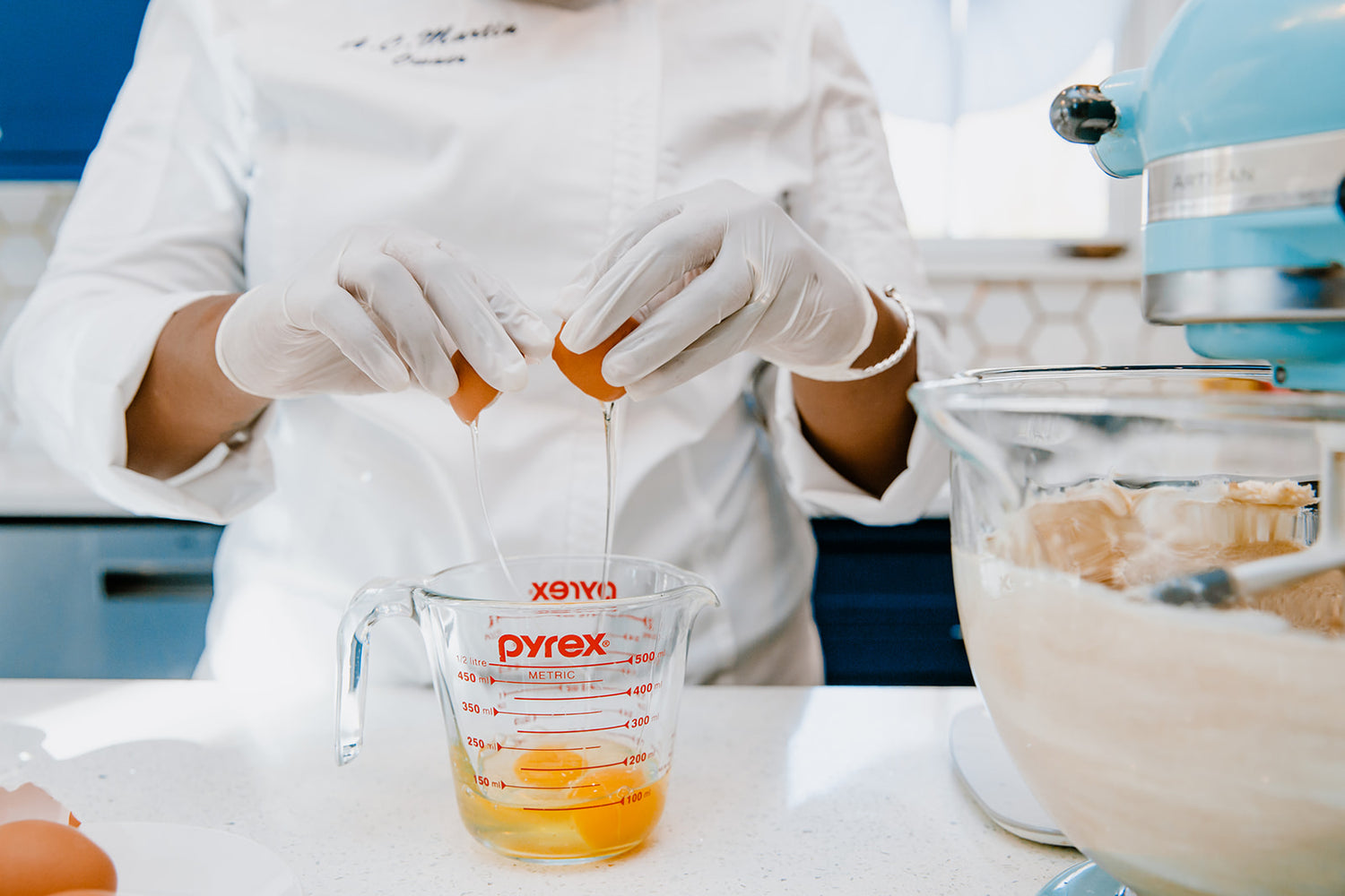 Anrika baking fresh wedding cake in Hudson Valley